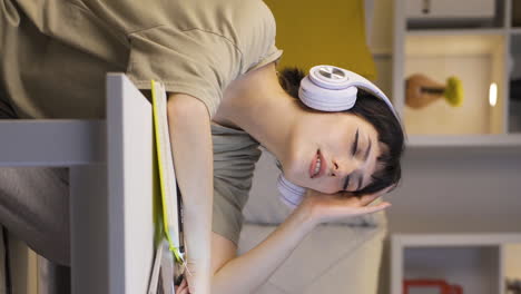 Vertical-video-of-Listening-to-music-at-home-at-night-is-comfortable-and-calm.